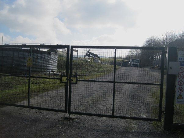 Compare and contrast: no sign of any razor wire on top of the gate or fences at this conventional drilling site at nearby Cootham